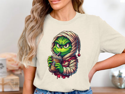 Festive Grinch Drinking Coffee Graphic Tee product type